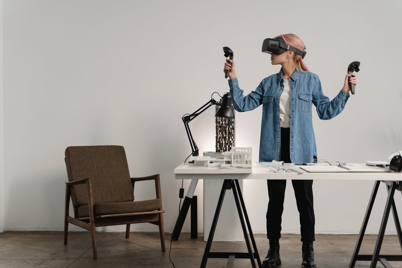 A woman with pink hair explores virtual reality in a minimalist office setting.